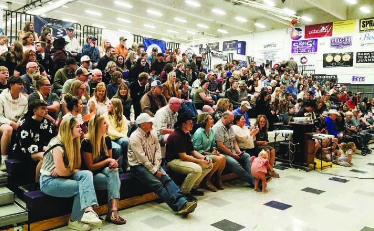 The bleachers were packed as the community waited for the Rye FFA Labor Auction to start. Photo by Shirley Pigg