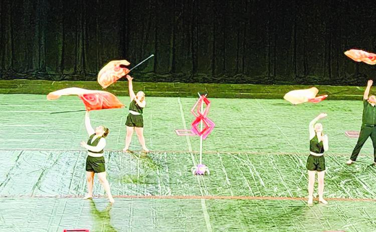 The Thunderbolt WinterGuard twirl their flags in their award-winning state championship performance. Courtesy Photo