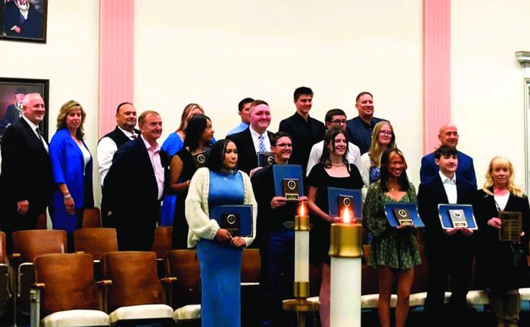 Following the awards ceremony, the recipients posed with their school representatives. Michelle Mann-Madril was on hand to see Dodge and Kirk receive their awards. Courtesy Photo