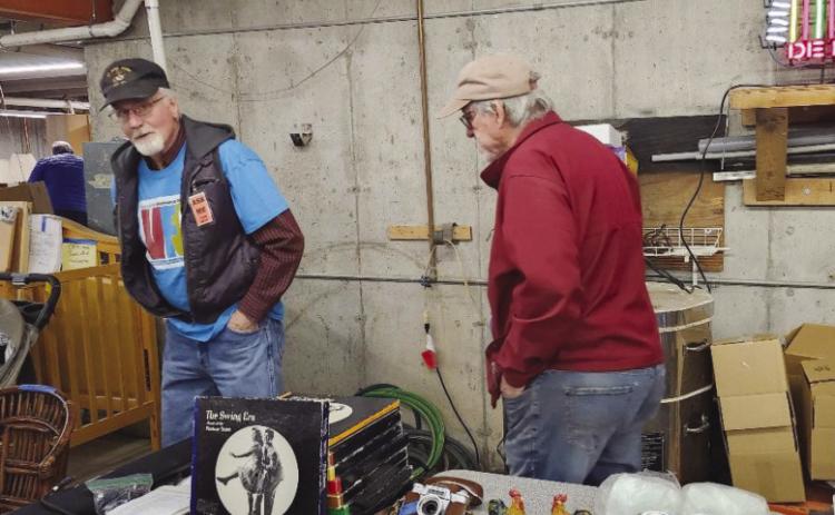 Sangre de Cristo VFC members Neil Elliot and Robert Johnson (R) lend a hand at the organization’s fundraising event on Saturday. Photo by Shirley Pigg