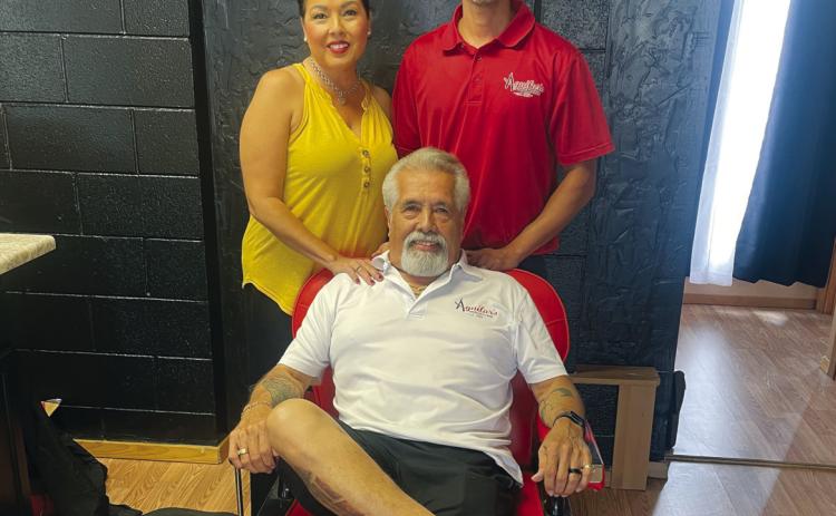 Owners/operators of Aguilar Family Hair Styling, center Louis Aguilar, left Stacie Barrett, right Carlos Barrett Courtesy Photo
