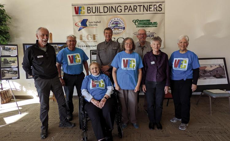 At the Susan Kalman Peaks to Prairie Community Center Grand Opening, a portion of the many who contributed time, labor and expertise to the project are (L-R) Tom Corlett, Harry Hochstettler, Susan Kalman, Larry Fogle, Judi Patrick, Robert Johnson, Terry Sanders and Gerri Nickel. Photo by Deb Straub
