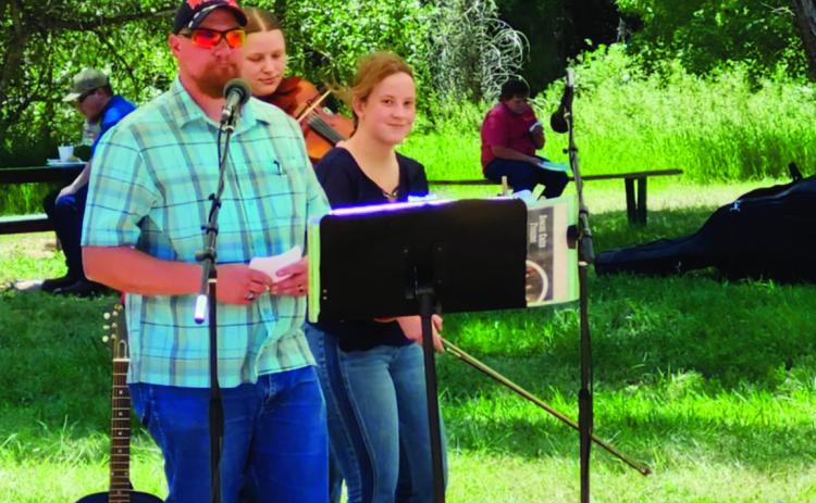 Jason Lovelace, Republican County Chairman for House District 46, welcomed everyone to the Taco Picnic on Saturday and introduced the candidates. See article on p. 6 Photo by Shirley Pigg