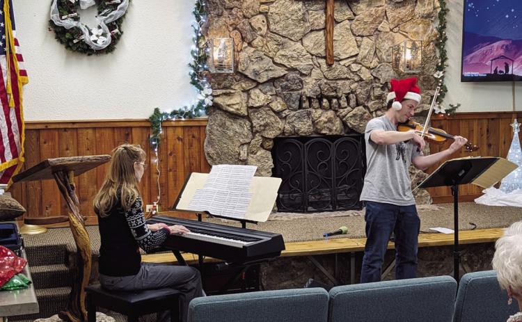 The River of Life Assembly of God Christmas program included a fiddle/violin arrangement played by Phil Hassey with Nancy Peterson accompanying. Photo courtesy of Deb Straub