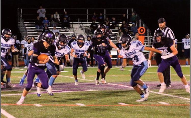 Quarterback Nolan Schauer rolls around right end against Trinidad, a game won by the Thunderbolts 47-0. Photo courtesy of Karen Rochester