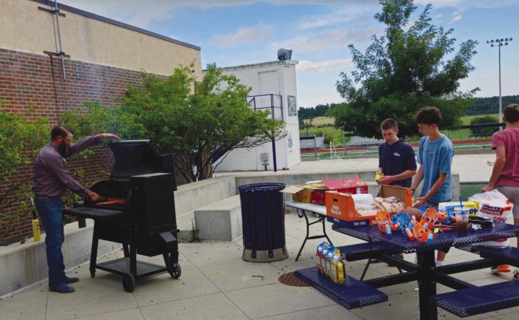 Ag teacher and FFA Advisor Ethan Beeman was everywhere at once, manning the grill, greeting students, and supervising games Photo by Shirley Pigg