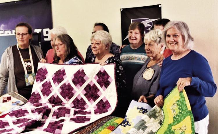 The hospice quilting project group of 13 quilters from the Scrappy Ladies Quilt Guild in Colorado City. Photo by Shirley PIgg