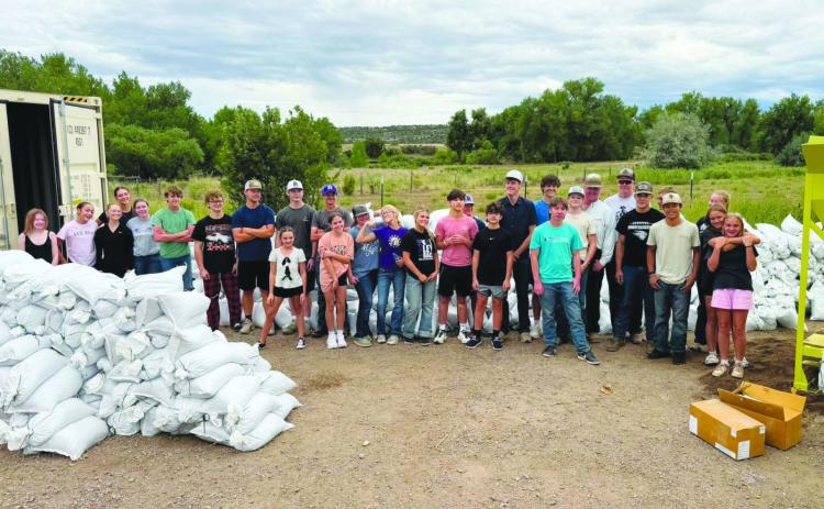Community volunteers, including youth have been turning out to help fill sandbags to help with flooding. Courtesy Photo