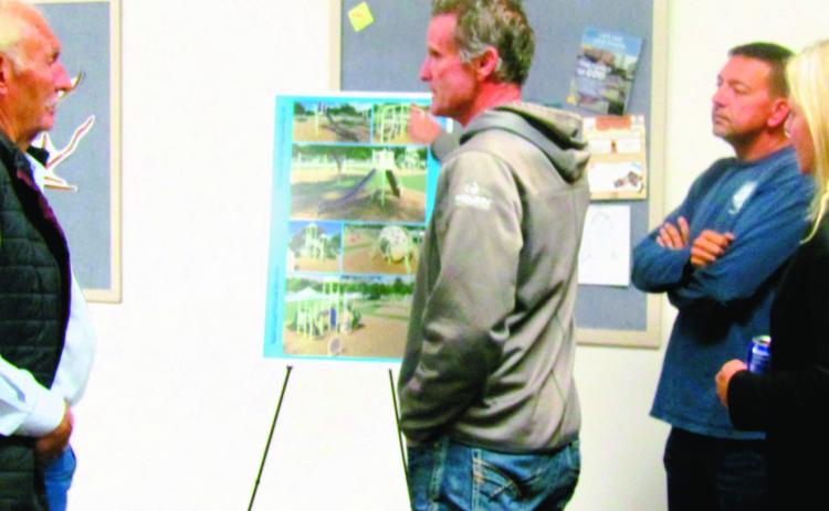 Abe Armendariz, Park Supervisor for Pueblo County Parks and Recreation, explains new playground equipment slated for Rye Mountain Park. Photo by Shirley Pigg