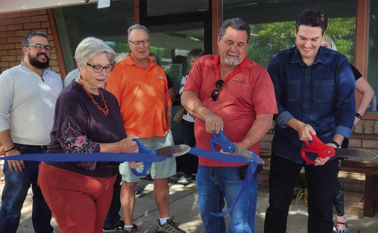 Marty Rahl, Mayor of Rye; Jim Eccher, Colorado City Metro District Manager; and Miles Lucero, Pueblo County Commissioner (L-R front) cut the ribbon celebrating Pueblo County services becoming available in Colorado City. CCMD Board Members Karim Ayoub and Ray Davis (back L-R) Courtesy Photo