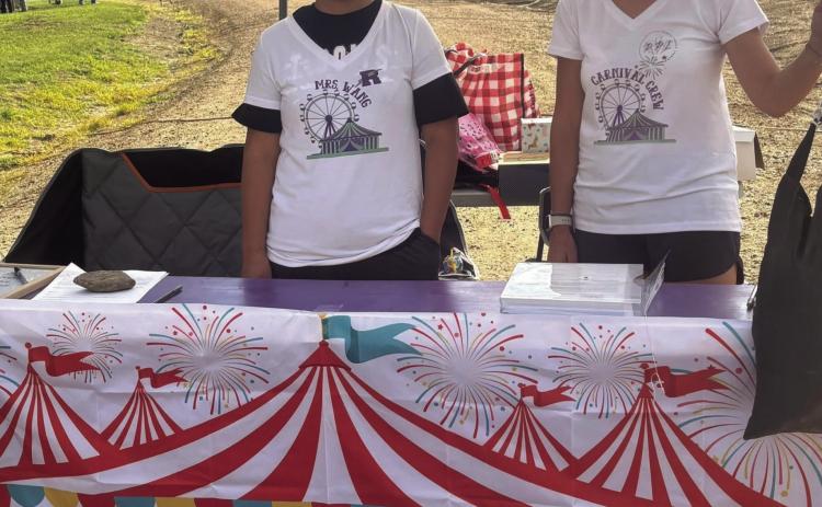 Mrs. Wang and Mrs. Pagano were happy to help with the carnival and get to see the new students Photo by Shirley Pigg