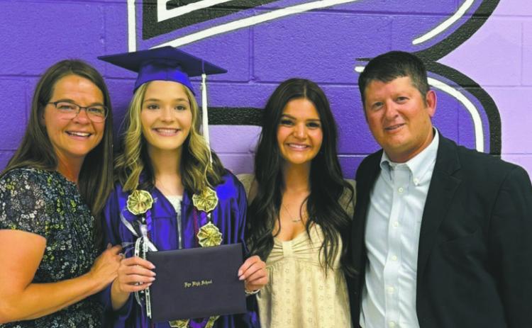 Coach Catherine Gallegos (L), daughter Morgan, daughter Lauren, and husband Mac. Courtesy Photo