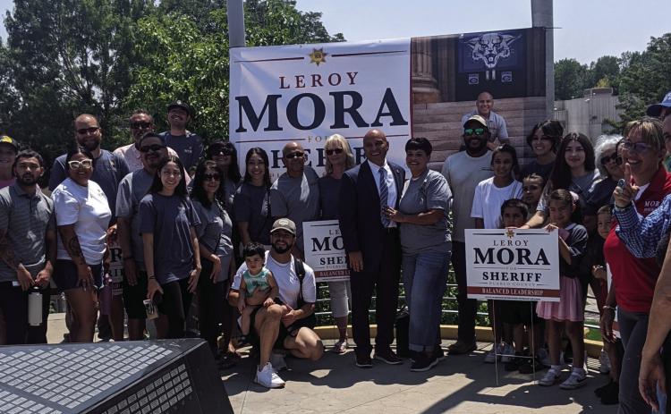 Leroy and Kathy Mora, surrounded by supporters, officially announced Mora's candidacy for Pueblo County Sheriff. Courtesy Photo