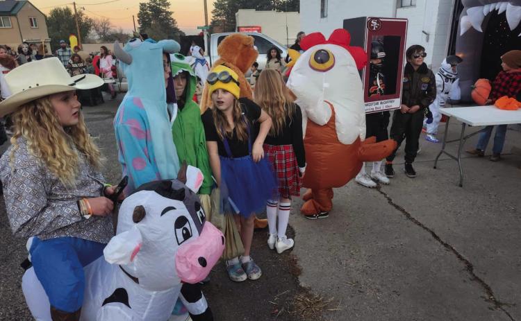 Costume Contest entrants lined up outside the Rye Fire Station for Rye Fire Protection District employees to award ribbons and treats