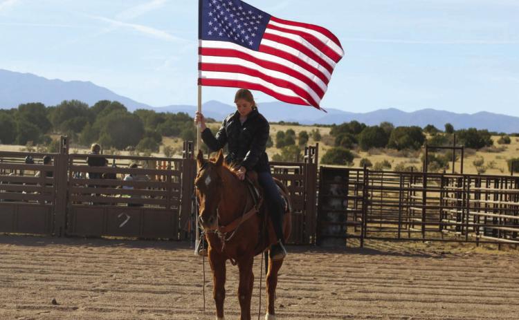 Donna Fern and Trigger carrying the American Flag at a local rodeo Courtesy Photo