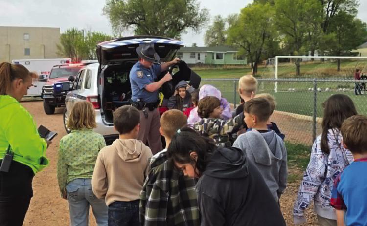 The Colorado State Patrol let the students try on some of their protective gear Photo by Shirley Pigg