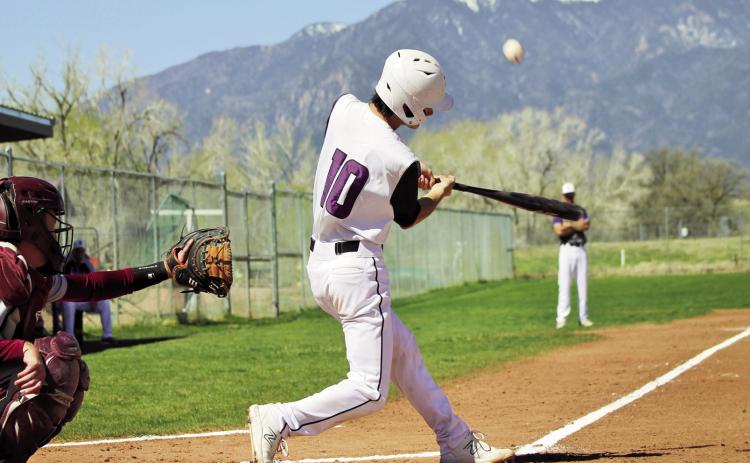 Will Hamler drives the ball in to left field for a hit. The entire Rye team seemed to gel last week with three impressive victories. Photo by Karen Rochester