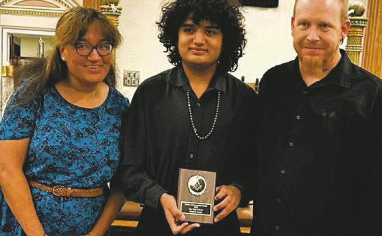 Rye High School Masonic Public-School Achievement Award recipient Micheal Amaya (center) with his parents Courtesy Photo