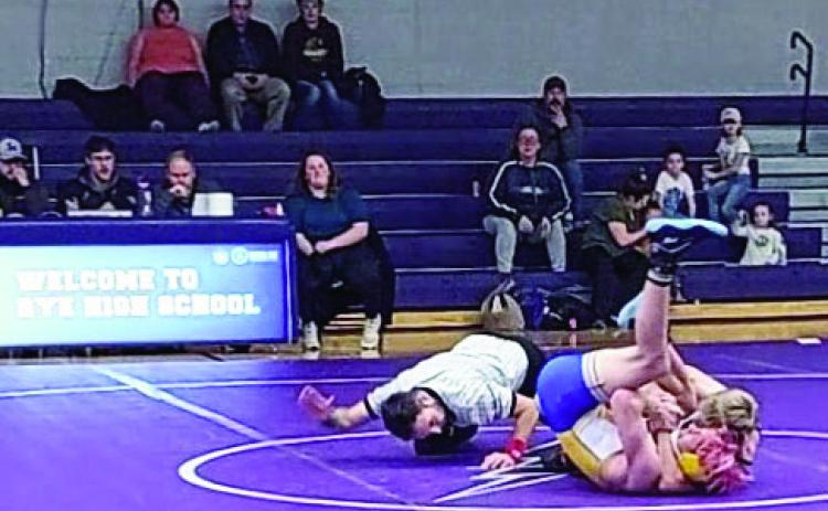 Hyrum Peterson (Rye) has a cradle pin against his opponent from Dolores Huerta Prep on 12-15-2022 Courtesy Photo