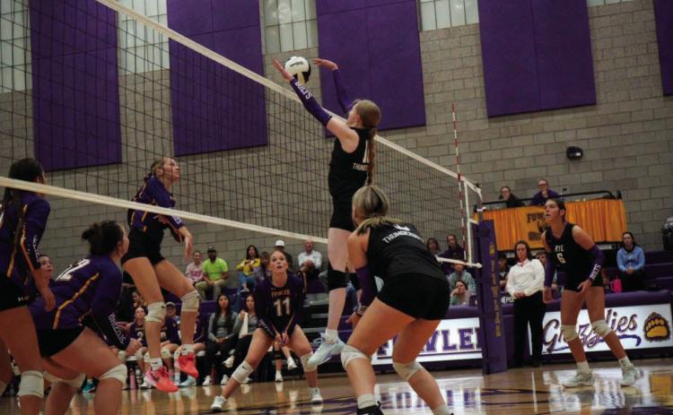 Hayley Newitt blocks a shot in Rye High School volleyball action last week. Courtesy Photo
